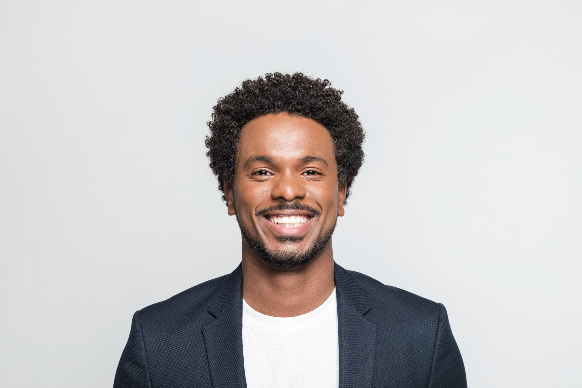 Headshot of cheerful young businessman