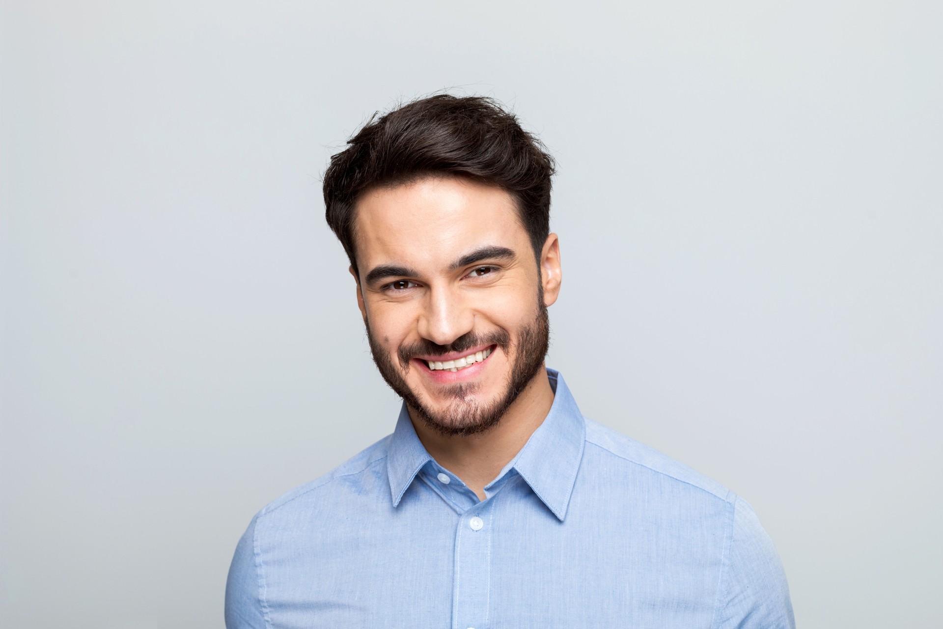 Headshot of happy young businessman